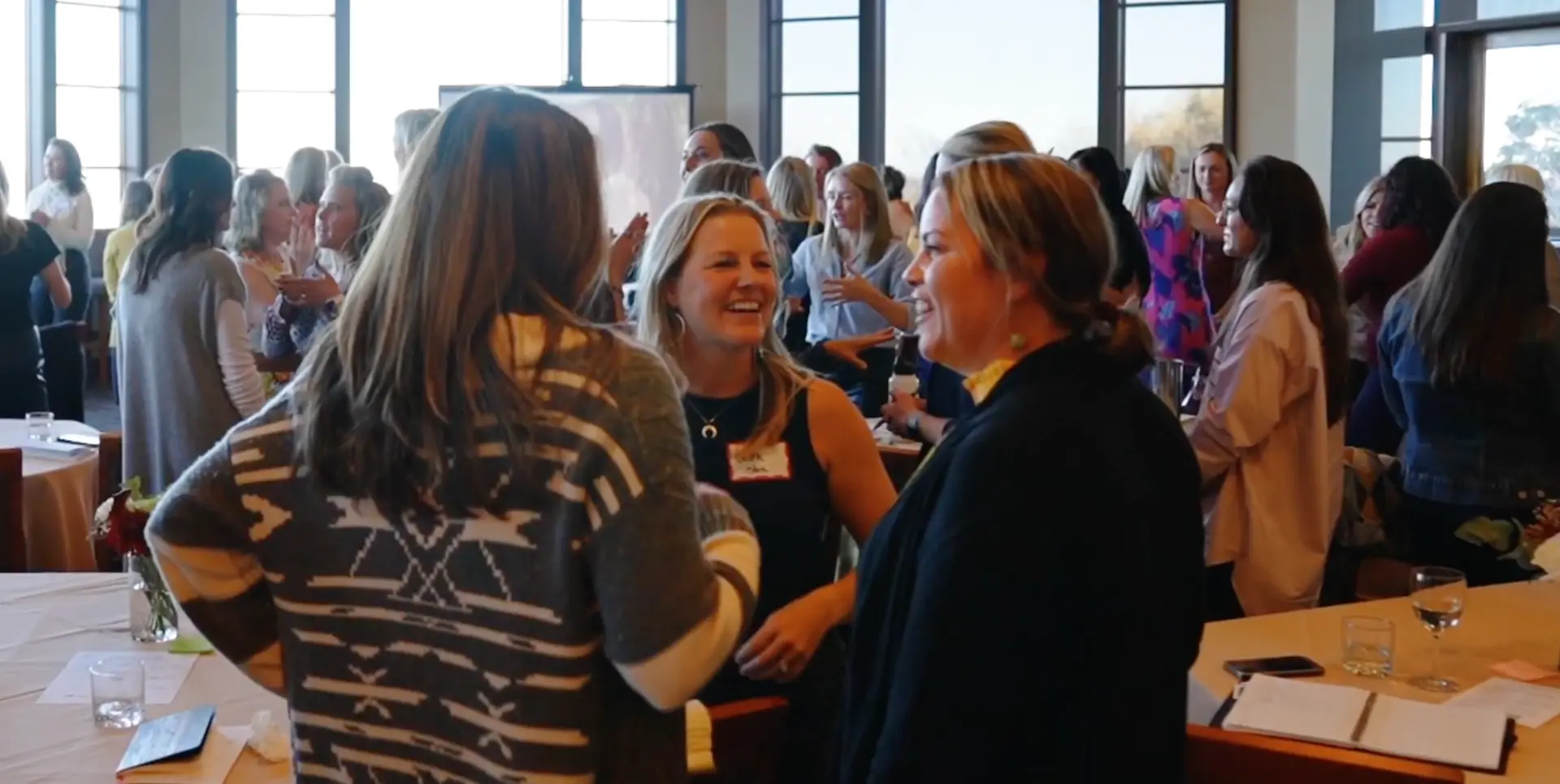 Attendees in real conversation at one of Lisa's connection experiences
