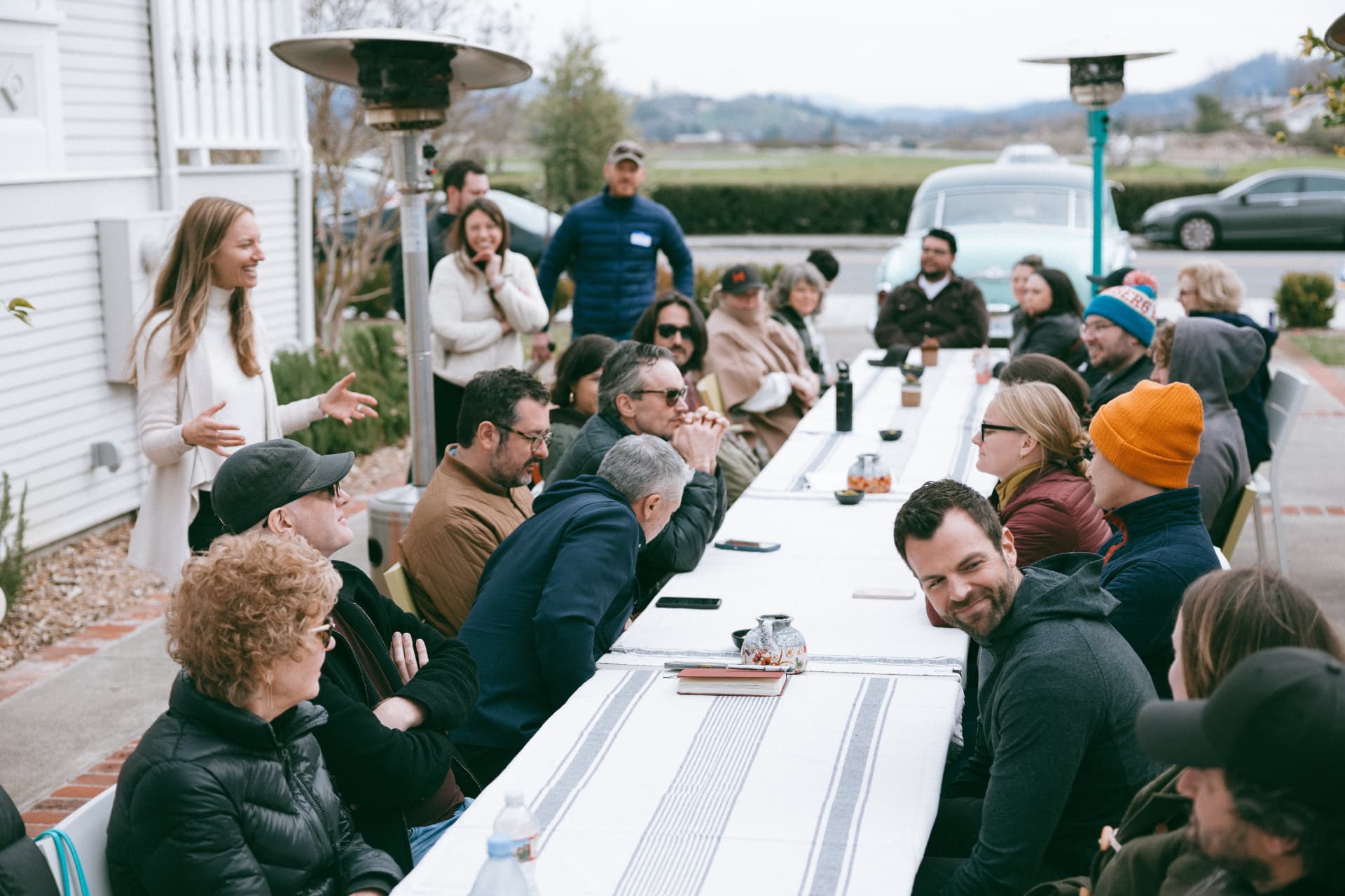 Guests connecting over a curated M Wines group lunch during an event-wide experience
